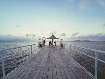 Pier over sea against sky