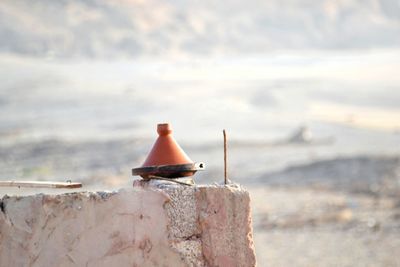 Close-up of beach against sky