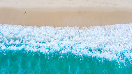 Aerial top view the emerald sea and small tourist at surin beach, phuket, thailand,