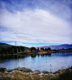 Reflection of trees in calm lake