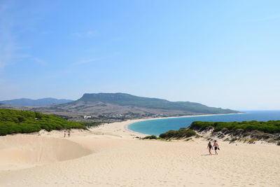 Scenic view of beach against clear sky