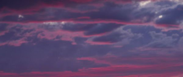 Low angle view of dramatic sky during sunset