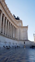 Group of people in front of historical building