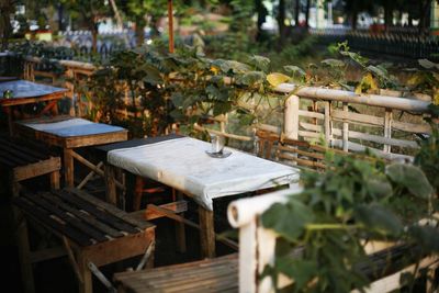 Empty chairs and coffee cup on table 