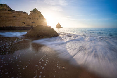 Scenic view of sea against sky during sunset