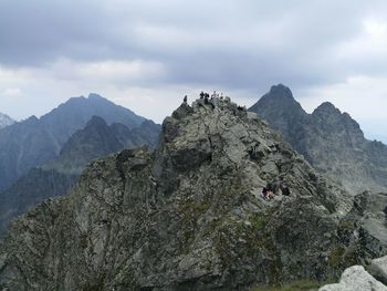 Scenic view of rocks and mountains against sky