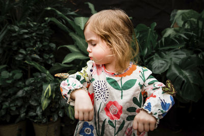 Full length of girl with plants