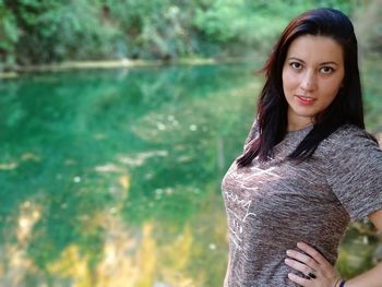 Portrait of smiling young woman standing outdoors