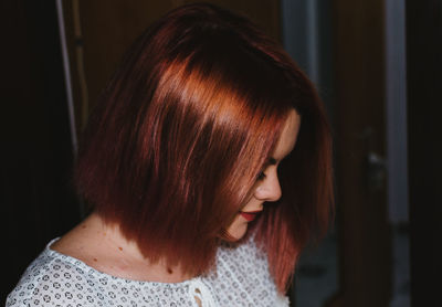 Close-up of young woman looking down