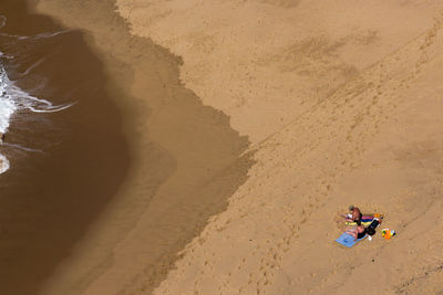 High angle view of tourist on beach 