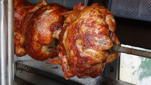 Close-up of chicken on barbecue grill