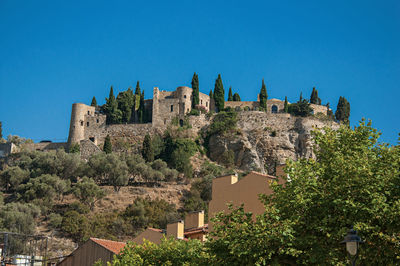 View of castle on top of a hill near the city center of cassis, france.