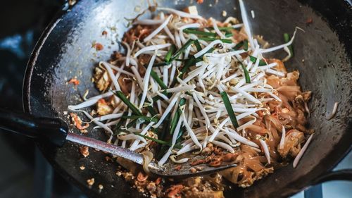 High angle view of meat in cooking pan.pad thai