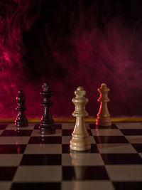 Close-up of chess pieces on table