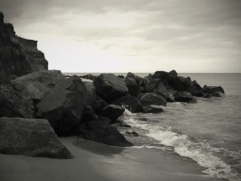 Scenic view of sea against cloudy sky