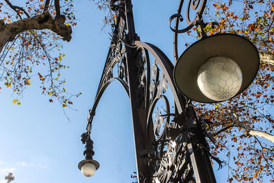 Low angle view of street light against sky