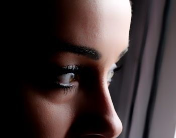 Close-up of young woman looking away