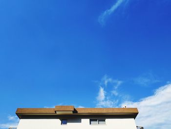 Low angle view of building against blue sky