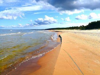 Scenic view of beach against sky