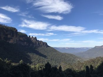 Scenic view of blue  mountains against sky