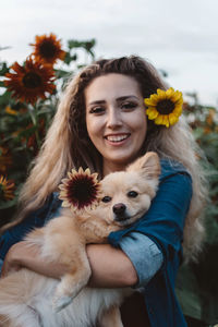 Portrait of young woman with dog