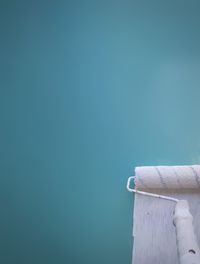 Close-up of wall against blue background