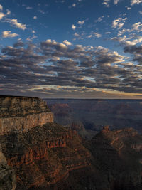 Scenic view of mountain against cloudy sky