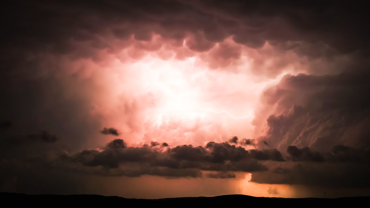 cloud, sky, storm, beauty in nature, thunderstorm, dramatic sky, power in nature, lightning, nature, storm cloud, environment, no people, thunder, night, warning sign, scenics - nature, cloudscape, dark, outdoors, silhouette, sunset, awe, sign, darkness, water, communication, overcast, ominous, atmospheric mood, landscape