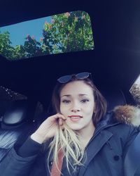 Portrait of woman in car