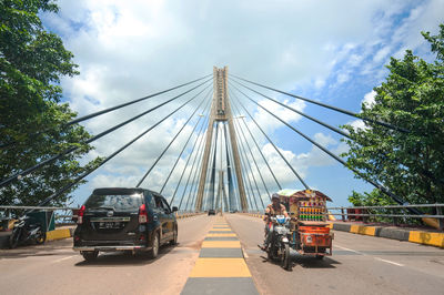 Cars on road against sky