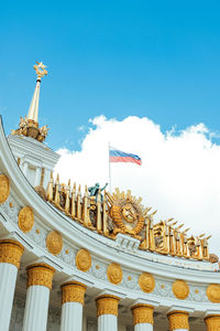 Low angle view of flags against sky