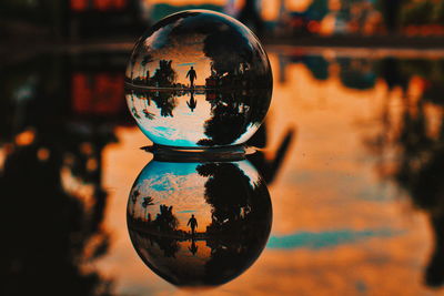 Reflection on crystal ball during sunset