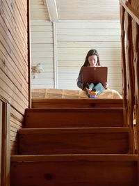 Girl student in quarantine studying remotely on a laptop