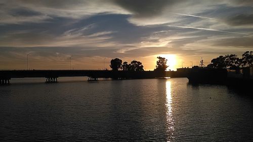 Scenic view of river at sunset