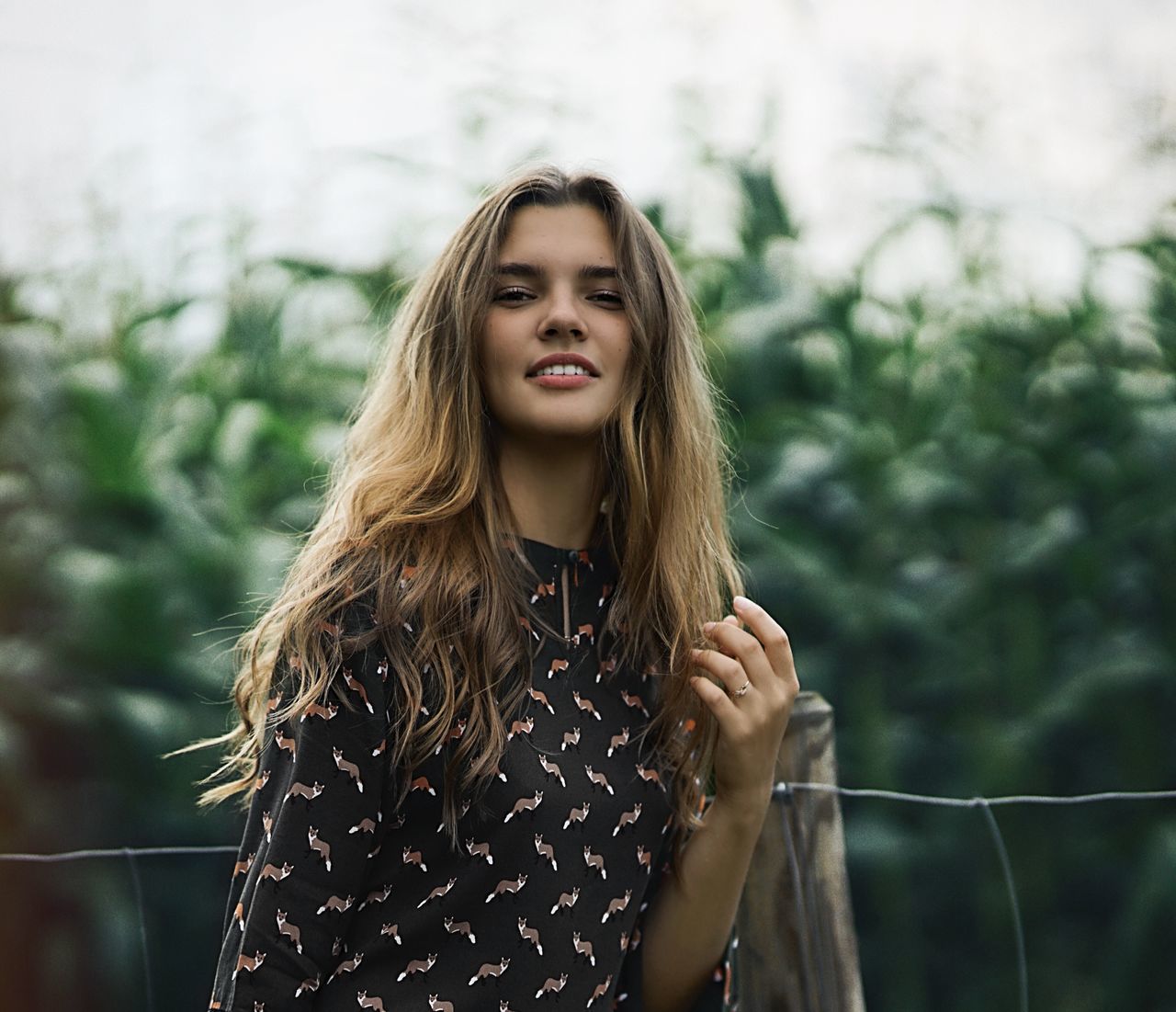 long hair, hair, hairstyle, one person, leisure activity, young adult, front view, lifestyles, real people, young women, focus on foreground, standing, casual clothing, waist up, portrait, women, beautiful woman, day, outdoors, teenager