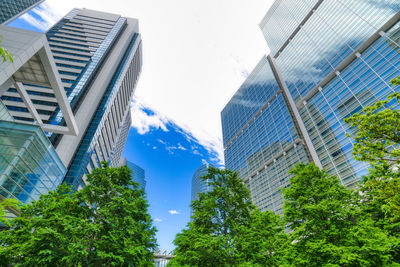 Low angle view of modern buildings against sky