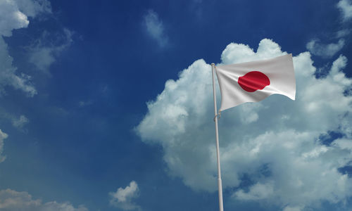 Low angle view of flag against sky