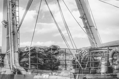 Close-up of ferris wheel against sky