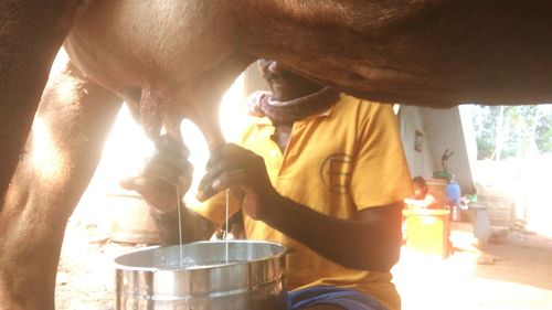 Midsection of man preparing food