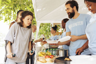 Portrait of smiling friends having food at home