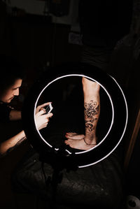 High angle view of man working in mirror