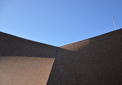 Low angle view of building against blue sky