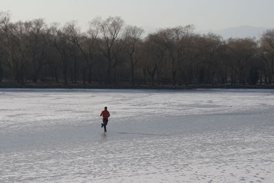 Full length of man on snow covered land