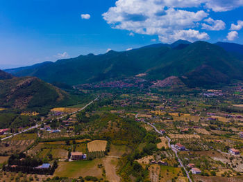 Aerial view of landscape and mountains against sky