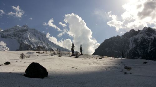 Scenic view of snowcapped mountains against sky