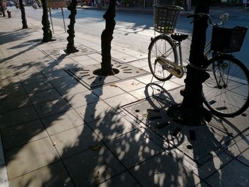 Bicycle parked on sidewalk in city