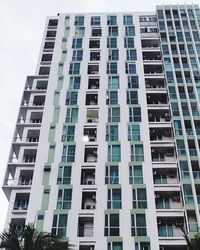 Low angle view of apartment building against sky