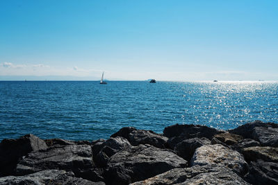 Scenic view of sea against blue sky