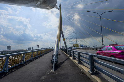 Bridge over road against sky