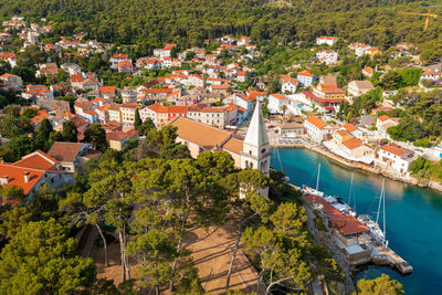 High angle view of townscape by sea